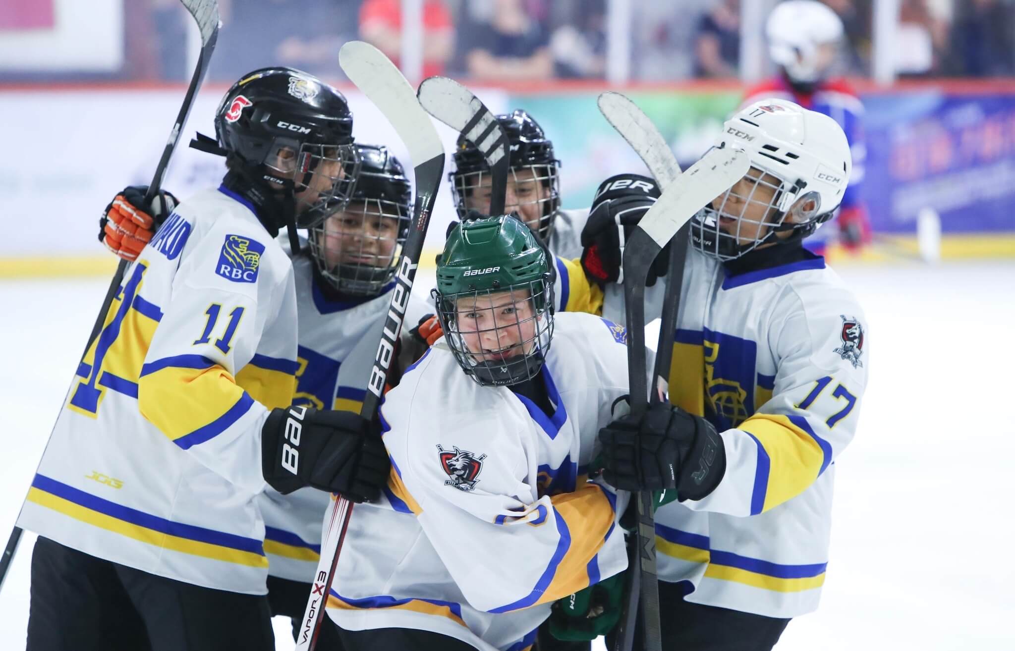 Teenage hockey players celebrating