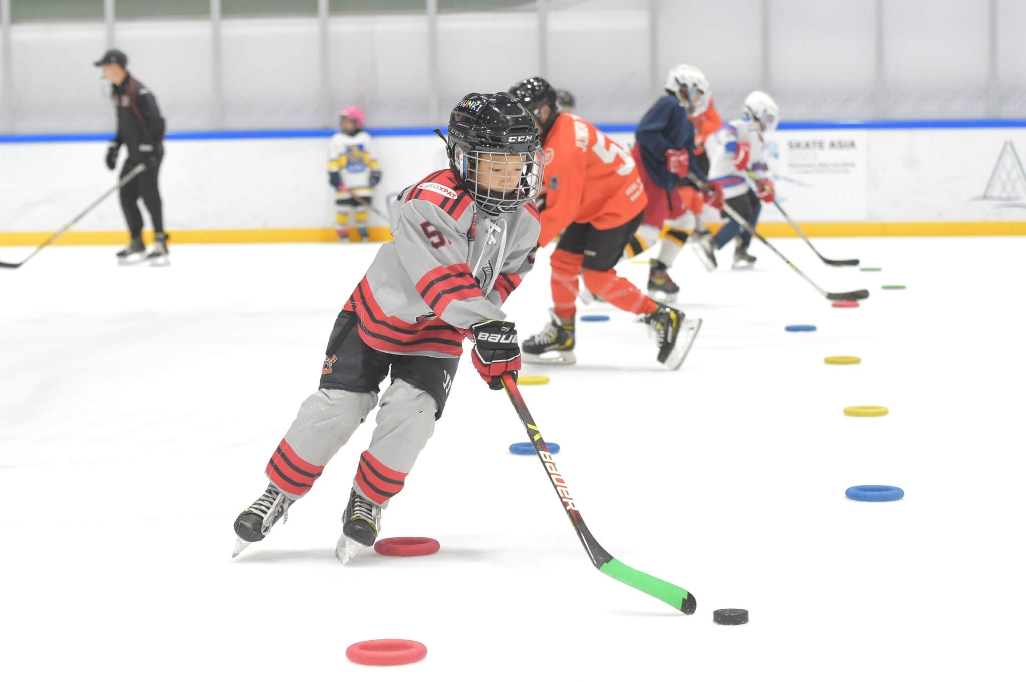 A young hockey player training
