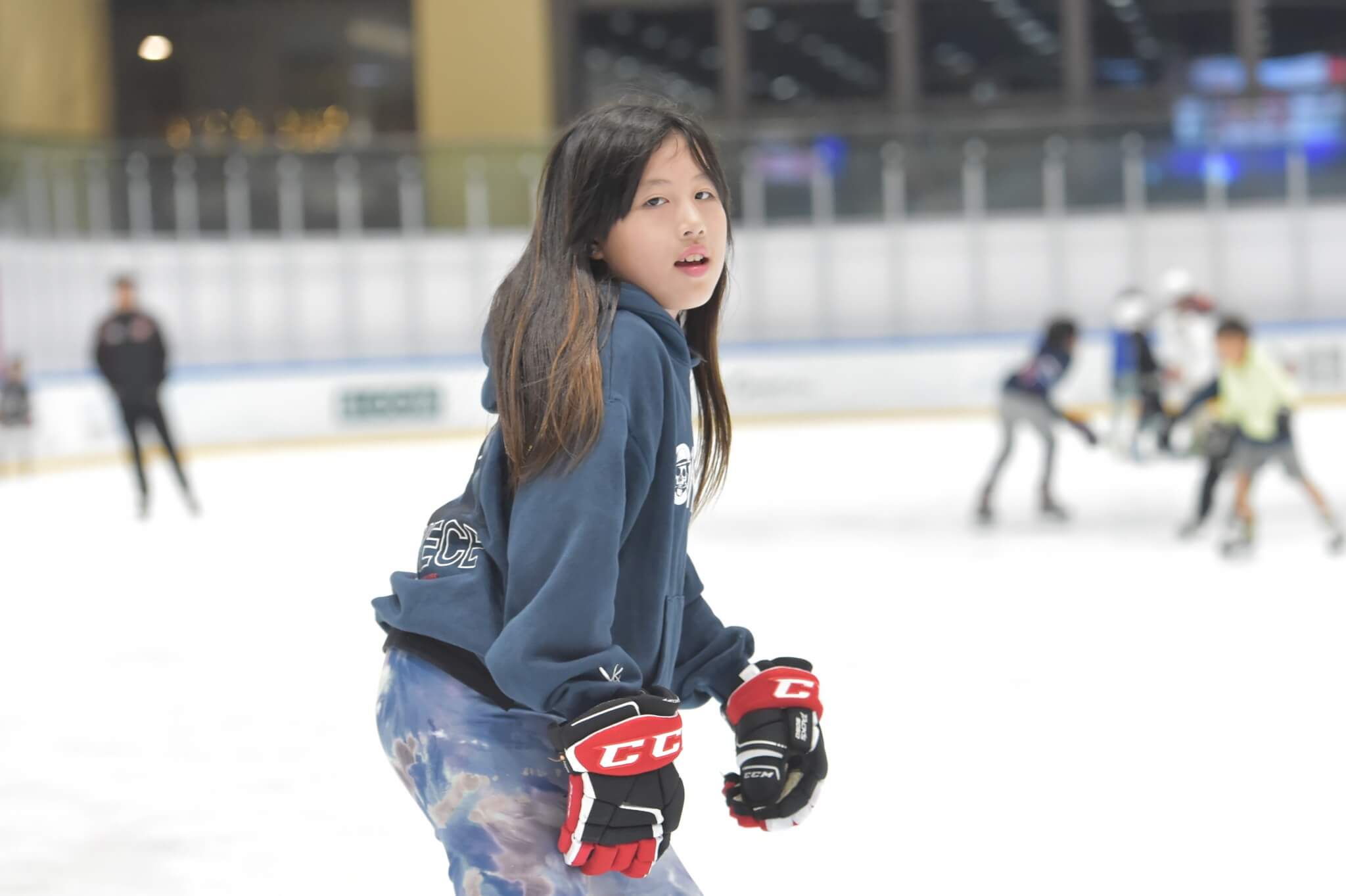 A young girl ice skating at the Discovery Bay Rink