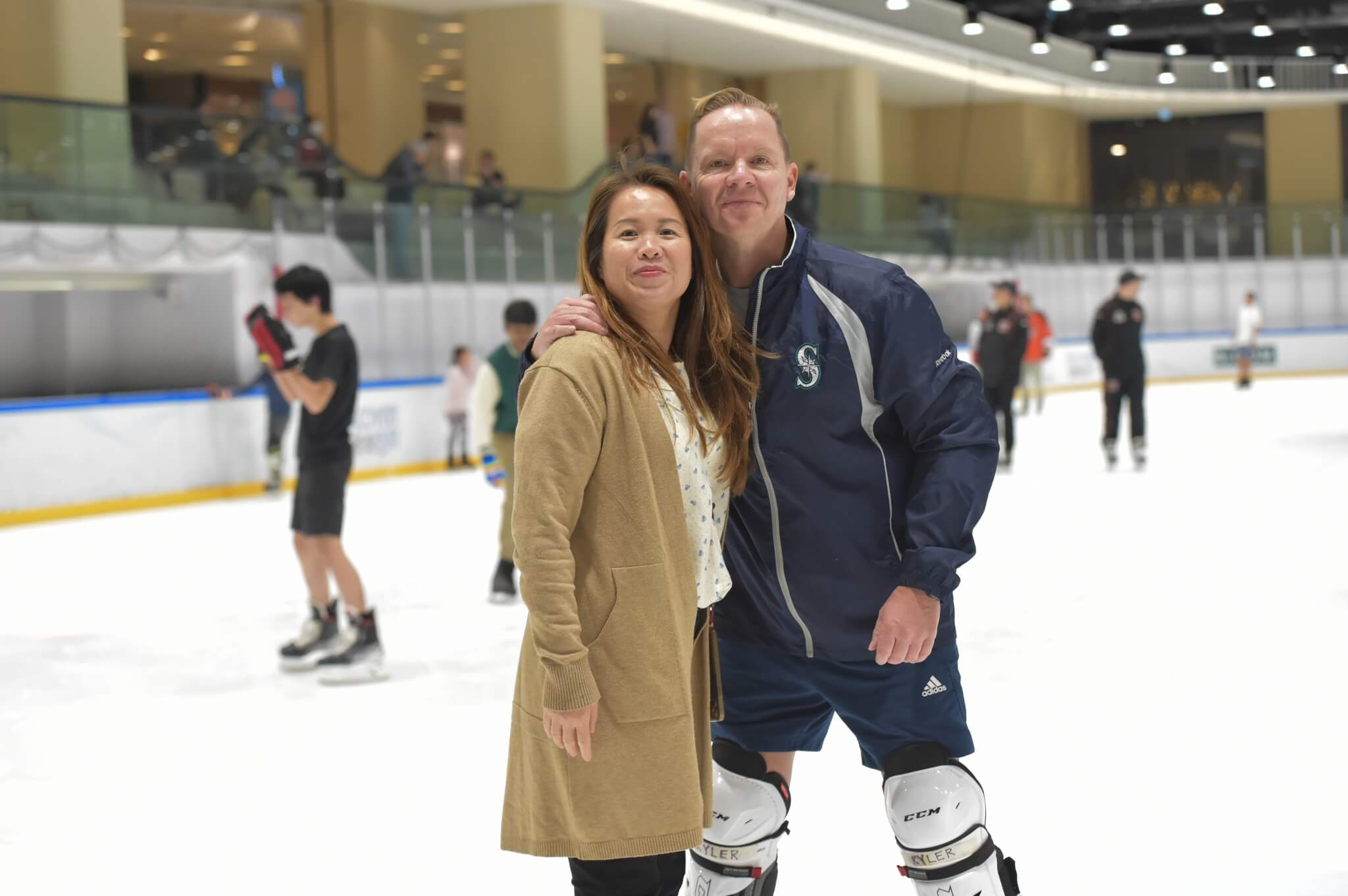 A woman and having at the Discovery Bay Rink's community skate event