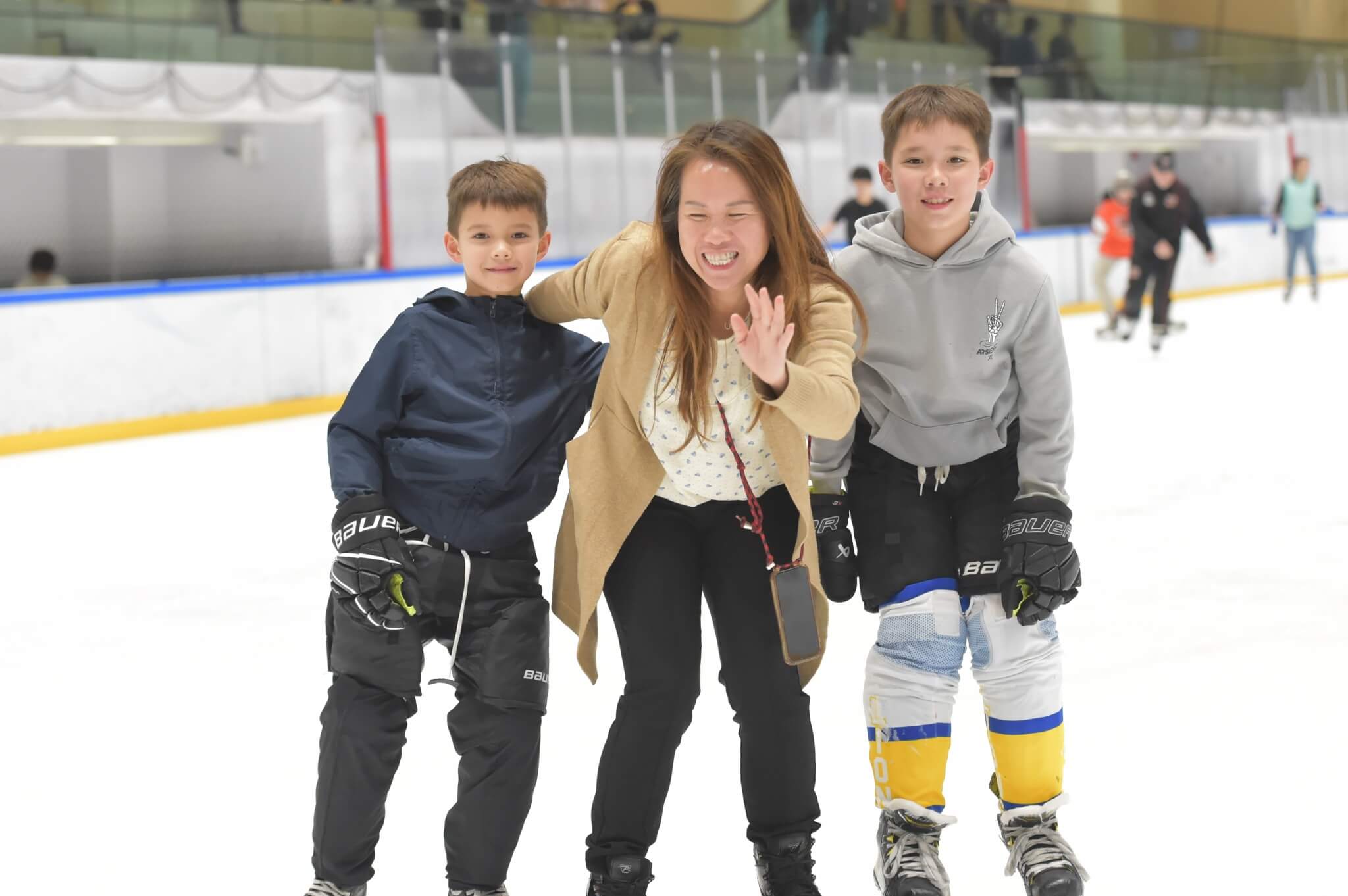 A woman and two kids at the DB ice Rink