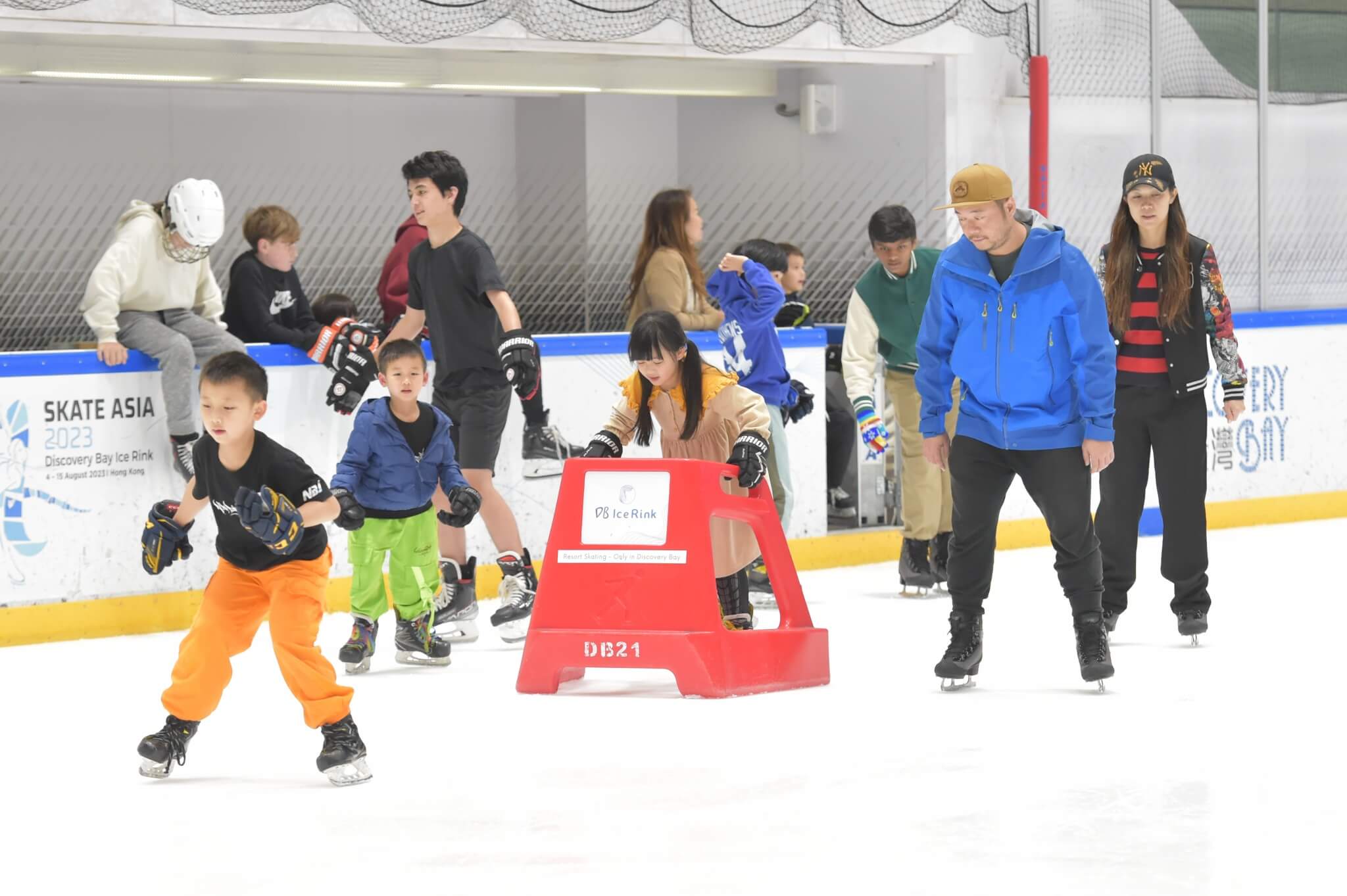 People of all age ice skating and having fun
