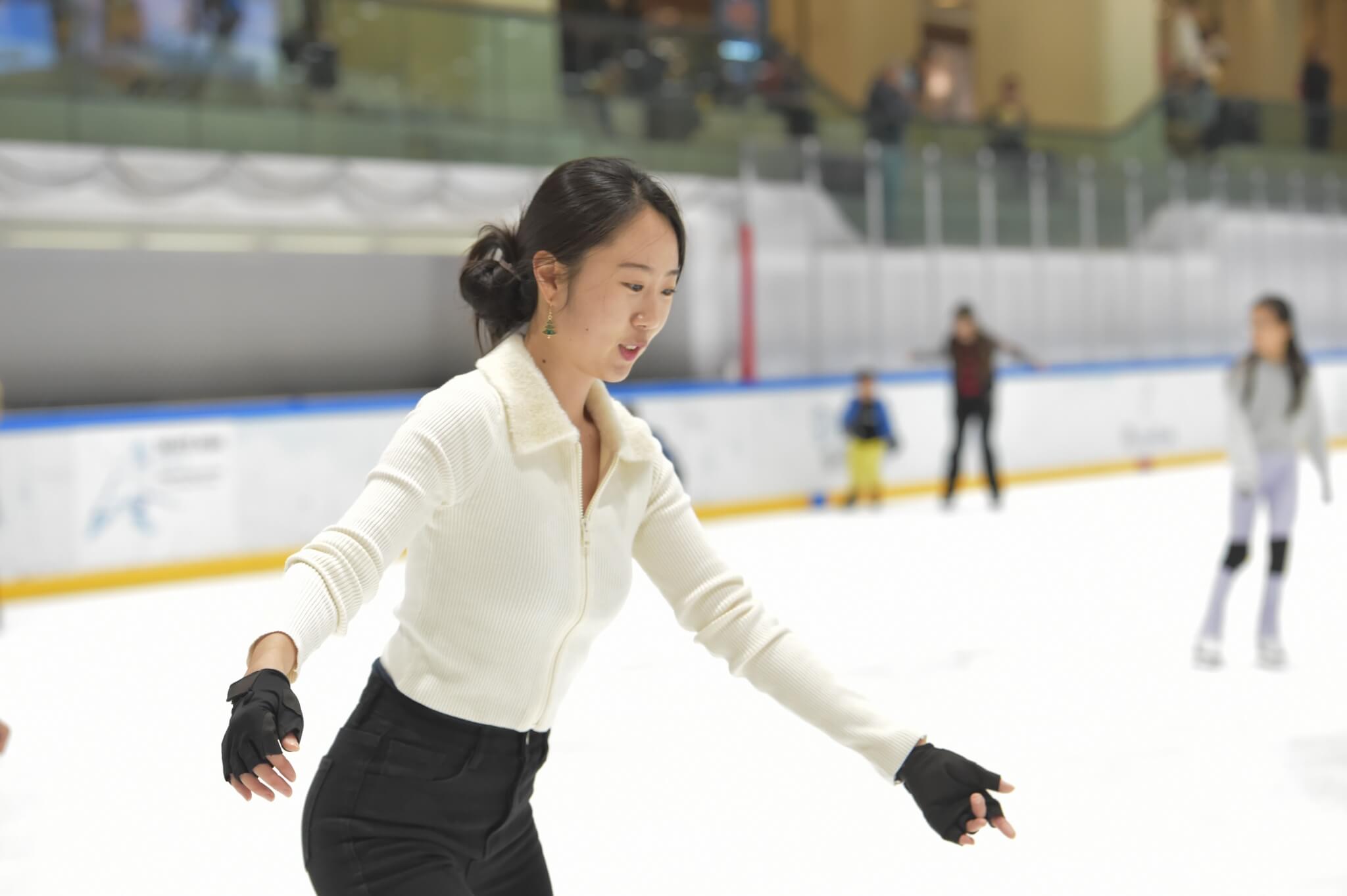 A Lady ice skating at Community Skate