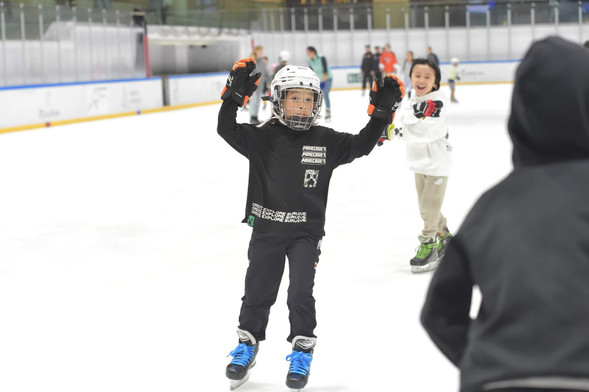 Kids having excited while ice skating